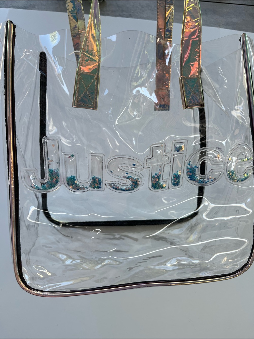 Your clear bag for the game, match, concert or beach. Accessorize for JUSTICE